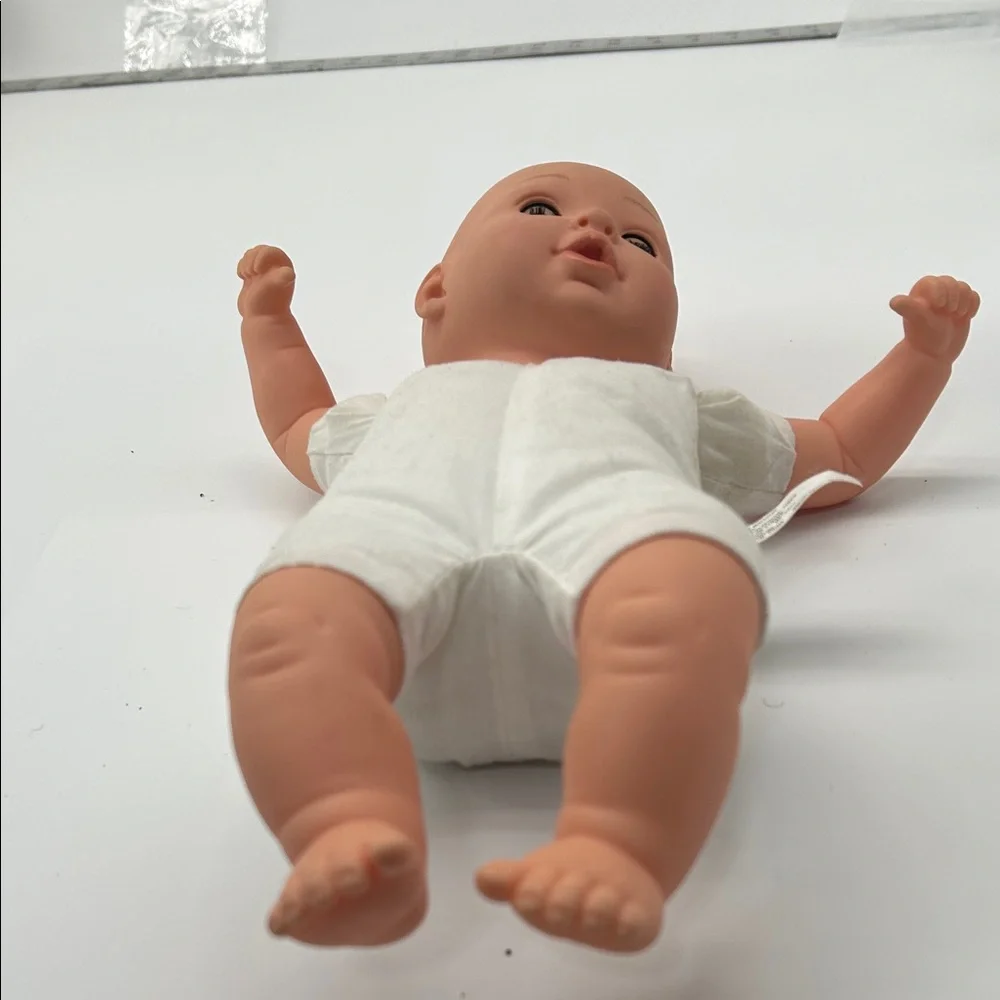 Realistic Baby Doll with White Outfit